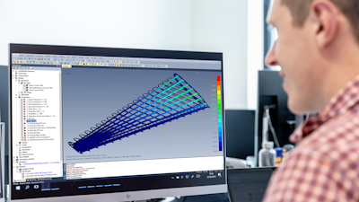 Engineer using Simcenter Femap to simulate performance of an airplane wing